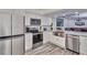 Modern kitchen with stainless steel appliances and farmhouse sink at 18400 Gulf Blvd # 1206, Indian Shores, FL 33785