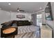 Spacious living room with a large sectional sofa and flat-screen TV at 18400 Gulf Blvd # 1206, Indian Shores, FL 33785