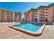 Sparkling community pool with plenty of lounge chairs at 18400 Gulf Blvd # 1206, Indian Shores, FL 33785