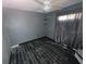 Bedroom with dark gray walls and tile floor at 4823 Steel Dust Ln, Lutz, FL 33559