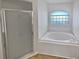 Bathroom with a large garden tub and shower at 6844 Northlake Dr, Zephyrhills, FL 33542