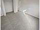 Bright bedroom with gray carpet and double doors to closet at 6844 Northlake Dr, Zephyrhills, FL 33542