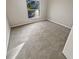 Spacious bedroom with gray carpet and a window at 6844 Northlake Dr, Zephyrhills, FL 33542