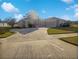 Single-story home with two-car garage and landscaped yard at 6844 Northlake Dr, Zephyrhills, FL 33542