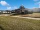 One-story house with a large front yard and driveway at 6844 Northlake Dr, Zephyrhills, FL 33542
