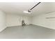 Attached garage with epoxy flooring and water heater at 408 Wedgefield Pl, Brandon, FL 33510