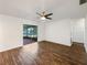 Bright living room with hardwood floors and sliding glass doors to patio at 4606 Southbreeze Dr, Tampa, FL 33624