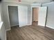 Bright bedroom featuring luxury vinyl plank flooring, closet, and crown molding at 12263 Cartouche Ave, Punta Gorda, FL 33955