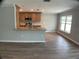 Open concept kitchen with stainless appliances, granite countertops, and bar seating at 12263 Cartouche Ave, Punta Gorda, FL 33955