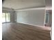 Open concept living room featuring wood-look floors, recessed lighting, and neutral paint at 12263 Cartouche Ave, Punta Gorda, FL 33955