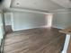 Inviting living room with wood-look floors, recessed lighting, and an open layout at 12263 Cartouche Ave, Punta Gorda, FL 33955