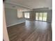 Inviting living room featuring wood-look floors, recessed lighting, and sliding doors to the lanai at 12263 Cartouche Ave, Punta Gorda, FL 33955