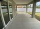 Covered patio with concrete flooring and view of the white fenced backyard at 12263 Cartouche Ave, Punta Gorda, FL 33955