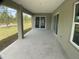 Spacious covered patio featuring concrete flooring overlooking the backyard at 12263 Cartouche Ave, Punta Gorda, FL 33955