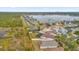 Aerial showing home near lake with conservation area in the background at 1657 Bonita Bluff Ct, Ruskin, FL 33570