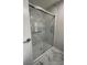 Modern bathroom with a large shower, marble tile, and glass enclosure at 3145 Hidden Lake Dr, Wesley Chapel, FL 33543
