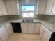 Updated kitchen features granite countertops and stainless steel appliances at 3145 Hidden Lake Dr, Wesley Chapel, FL 33543