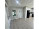 Modern kitchen with white cabinets and black appliances at 3145 Hidden Lake Dr, Wesley Chapel, FL 33543