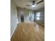 Main bedroom with ensuite bathroom and laminate wood flooring at 3145 Hidden Lake Dr, Wesley Chapel, FL 33543