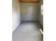 Unfinished storage area with concrete floor and door at 3145 Hidden Lake Dr, Wesley Chapel, FL 33543