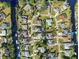 Aerial view of a waterfront residential neighborhood shows houses on canals and cul-de-sacs at 4367 Albacore Cir, Port Charlotte, FL 33948