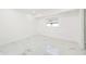 Clean bedroom with white walls, recessed lighting and marble floors at 4367 Albacore Cir, Port Charlotte, FL 33948