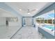 This covered patio features marble flooring and is an extension of the house to the pool area at 4367 Albacore Cir, Port Charlotte, FL 33948