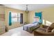 Bright bedroom with a double bed, couch, and large window at 2695 S East Ave, Sarasota, FL 34239
