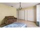 Bedroom with double bed, built in closet, and a chandelier at 2695 S East Ave, Sarasota, FL 34239