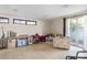Spacious living room with tiled floors and access to a patio at 2695 S East Ave, Sarasota, FL 34239