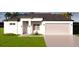 Charming single-story home with a two-car garage and well-manicured lawn at 11322 Zola Ave, Port Charlotte, FL 33981
