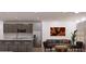 Open-concept living room and kitchen with modern appliances and stylish decor at 11322 Zola Ave, Port Charlotte, FL 33981