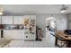 Galley-style kitchen with white cabinets and granite countertops at 2519 W Crest Ave, Tampa, FL 33614