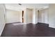 Dining area with wood-look floors, arched doorways, and a view into the adjacent kitchen at 27837 Sky Lake Cir, Wesley Chapel, FL 33544