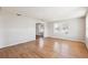 Spacious living room featuring hardwood floors and an arched entryway at 4035 Fairfield S Ave, St Petersburg, FL 33711