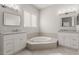 Bathroom with a corner soaking tub and double vanity at 14532 Mirasol Manor Ct, Tampa, FL 33626