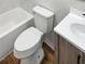 Clean bathroom with a bathtub, toilet and modern vanity at 10009 Connecticut St, Gibsonton, FL 33534