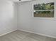 Spacious bedroom with neutral carpeting and ceiling fan at 10009 Connecticut St, Gibsonton, FL 33534