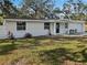 Newly renovated home with a well-manicured lawn at 10009 Connecticut St, Gibsonton, FL 33534