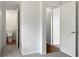Hallway with doors to bathroom and bedrooms at 10009 Connecticut St, Gibsonton, FL 33534