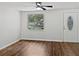 Spacious living room featuring hardwood floors and large window at 10009 Connecticut St, Gibsonton, FL 33534