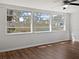 Sunroom with hardwood floors and large windows offering natural light at 10009 Connecticut St, Gibsonton, FL 33534