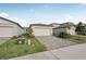 Side view of a house with a paved driveway and landscaping at 117 Whiteland Bnd, Nokomis, FL 34275