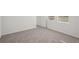 Simple bedroom with carpet flooring and a window at 120 Whiteland Bnd, Nokomis, FL 34275