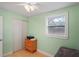 Bedroom with wood dresser and closet at 4016 W Mango Ave, Tampa, FL 33616