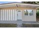 White front door with geometric patterned wall at 4016 W Mango Ave, Tampa, FL 33616