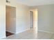 Spacious living room with tile floors and access to other rooms at 4714 S 87Th St, Tampa, FL 33619