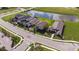 Aerial view of homes and a pond in a new residential community at 5807 Laurelcrest Gln, Palmetto, FL 34221