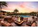 Community fire pit with seating area near pool at 5807 Laurelcrest Gln, Palmetto, FL 34221
