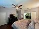 Main bedroom with king bed, ensuite bathroom access, and ample closet space at 1831 Cameron Ct, New Port Richey, FL 34655